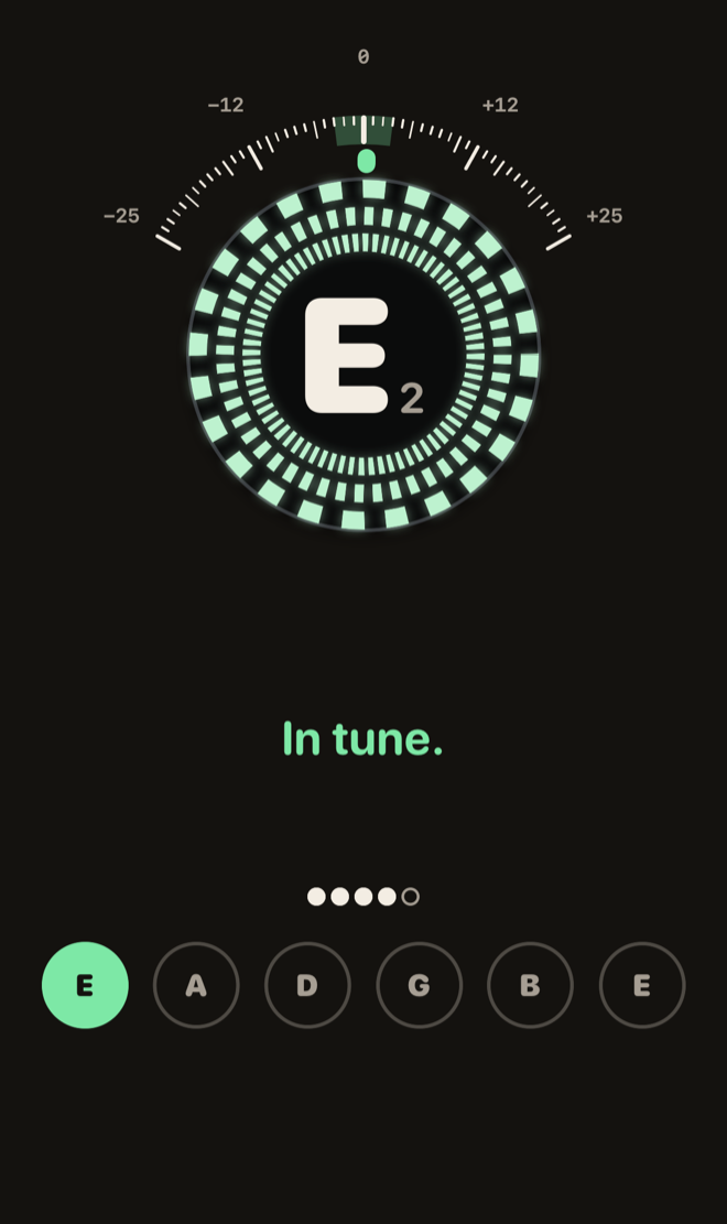 The strobe design in tune: the rings have turned mint green and stopped, with “In tune.” beneath.